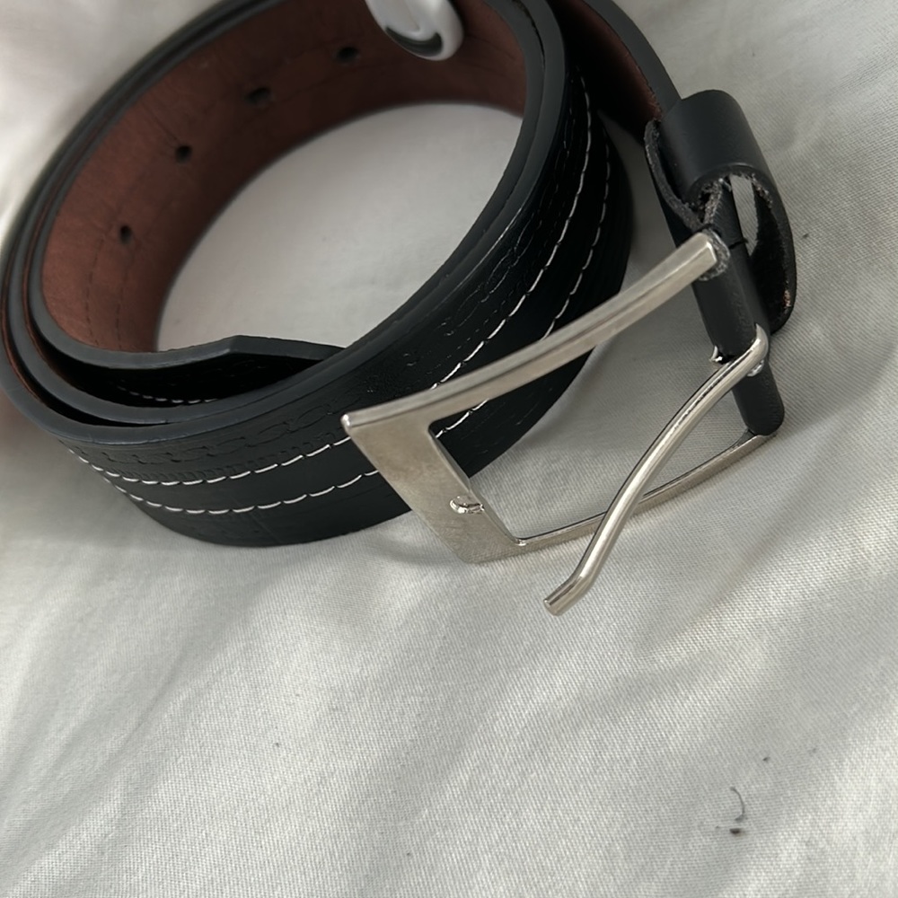 Black belt with double white stitching. 1 1/2 inches wide by 44 inches long.